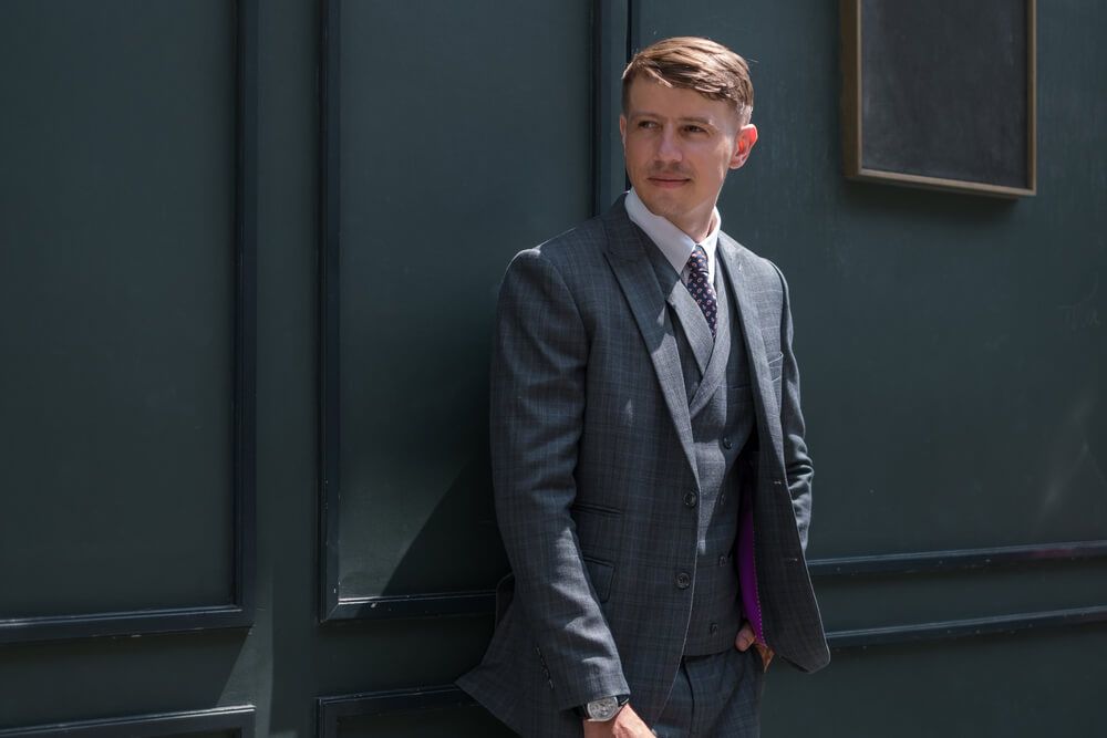 What colour shirt with a dark grey suit